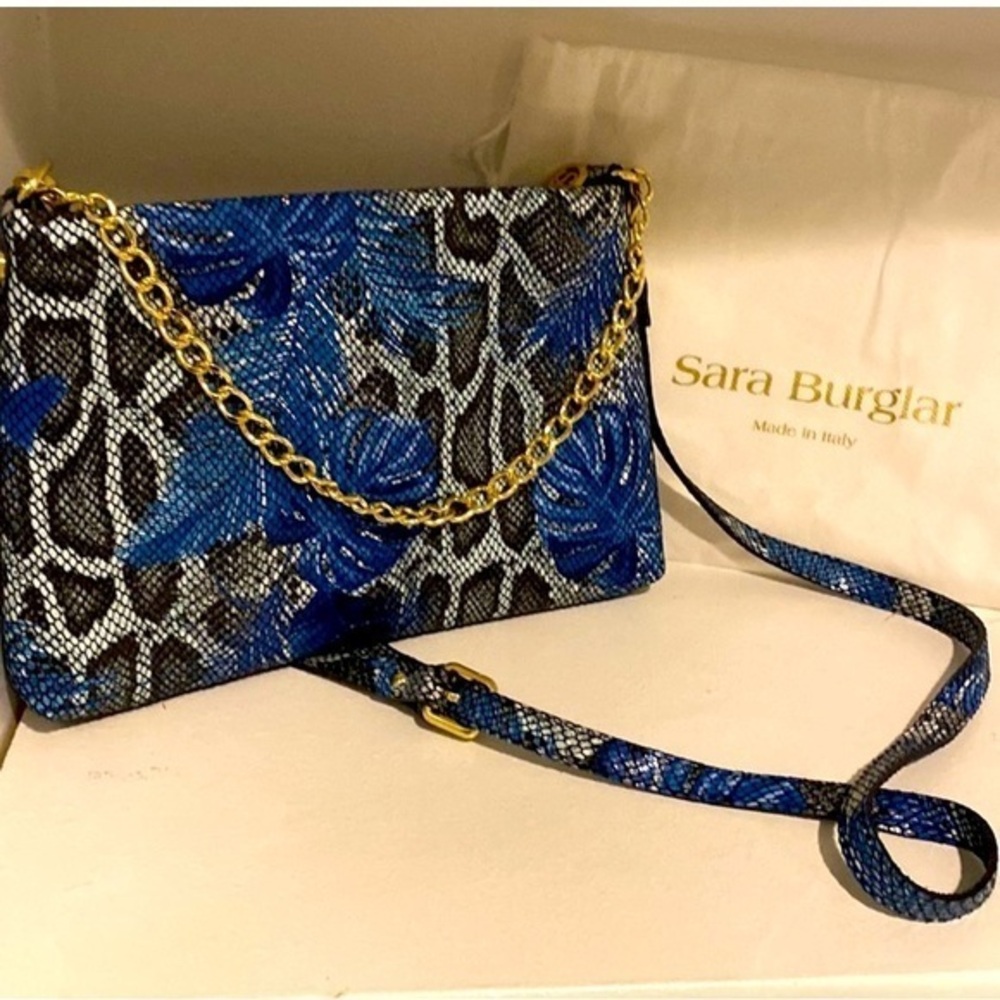 Sara Burglar Italian purse 
Genuine Leather Excellent Condition
Noemi Tropic